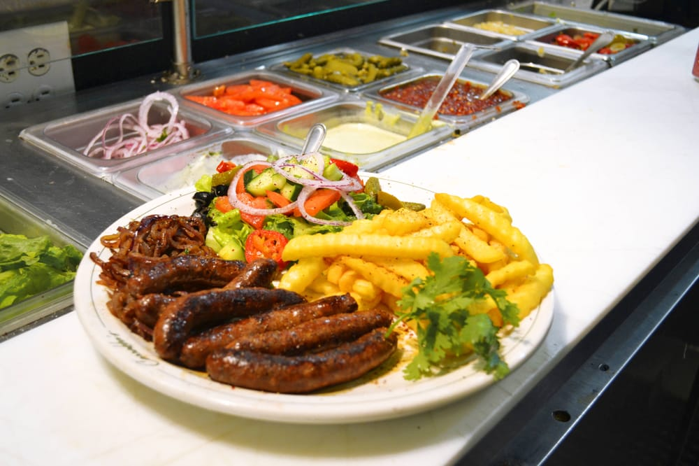 Grilled meat plate with fries and fresh salad